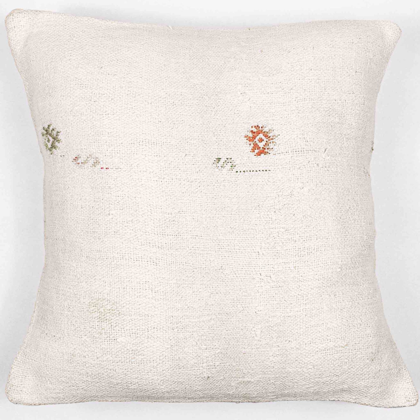 Handwoven Turkish kilim sisal pillow cover in cream with orange and green motif design accents.