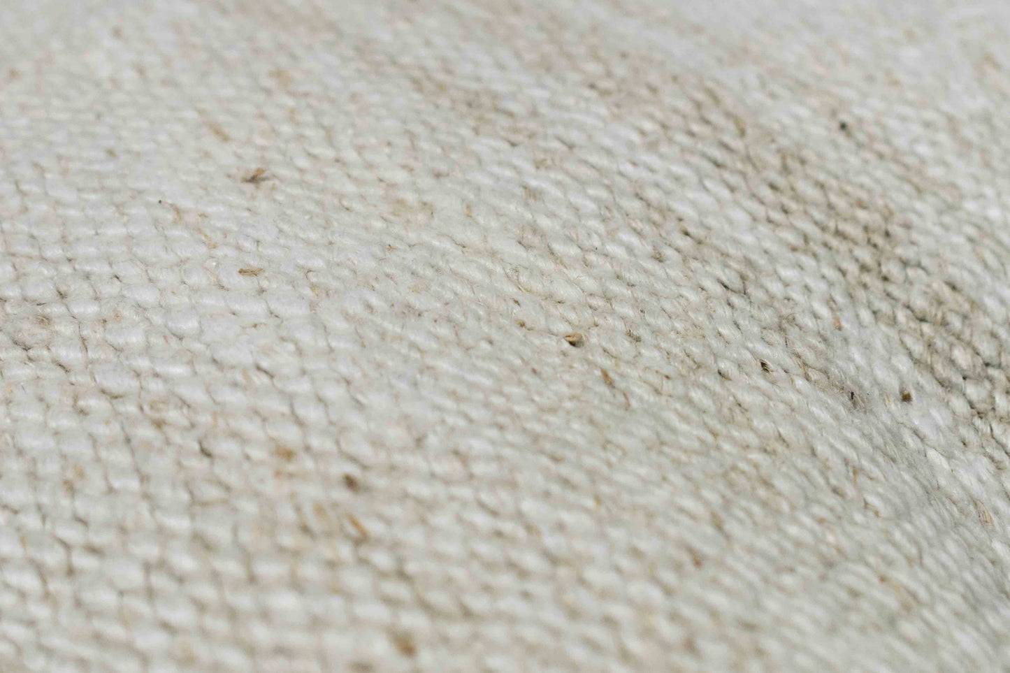Handwoven Turkish kilim sisal pillow cover fabric swatch in ivory white with light stripes.