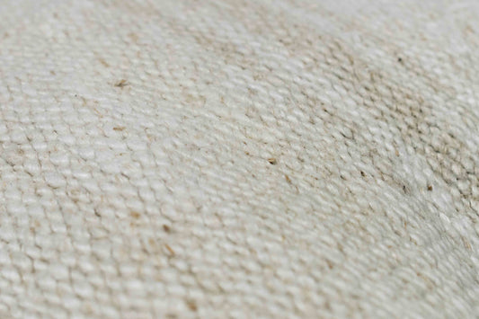 Handwoven Turkish kilim sisal pillow cover fabric swatch in ivory white with light stripes.