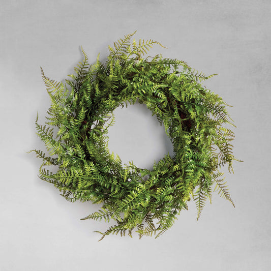 18" faux fern wreath with gray background.