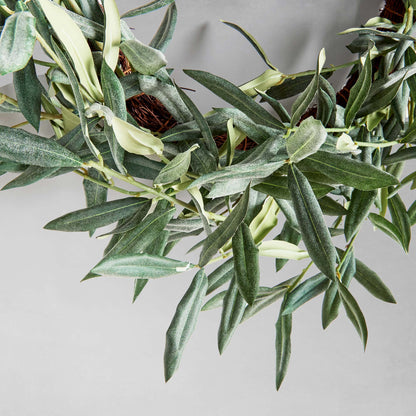 22" faux olive wreath, closeup view, with gray background.