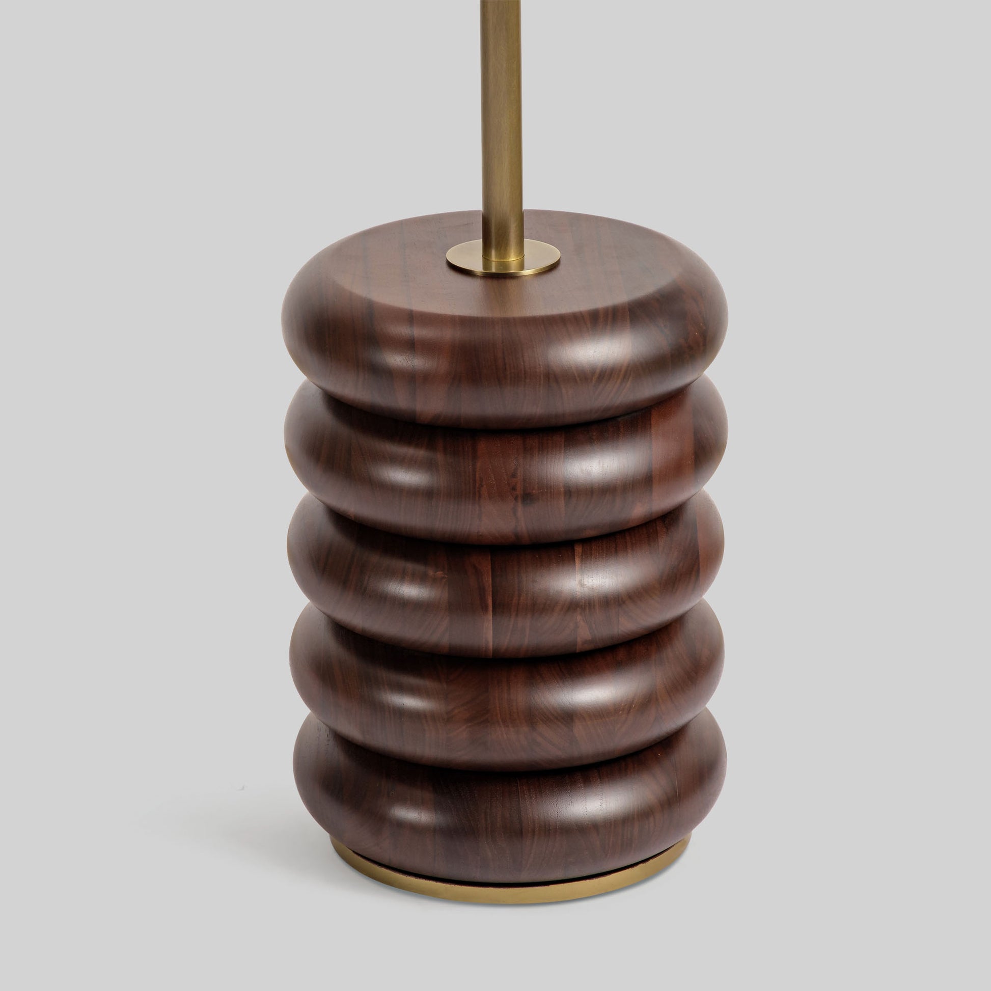 Floor lamp with a curved arm and wooden base on a light gray background.