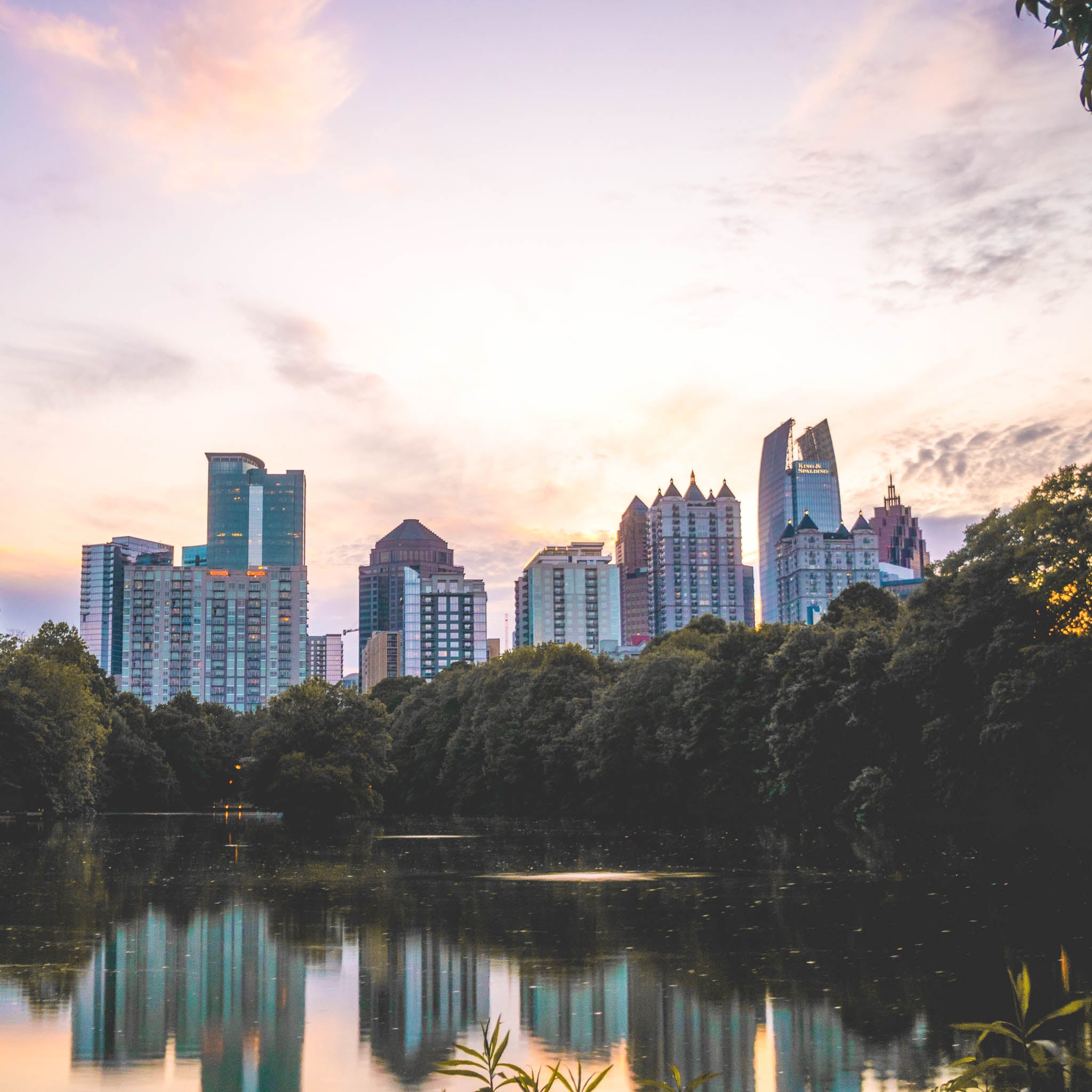 View of Atlanta skyline at dusk from Piedmont Park in Atlanta, Georgia.