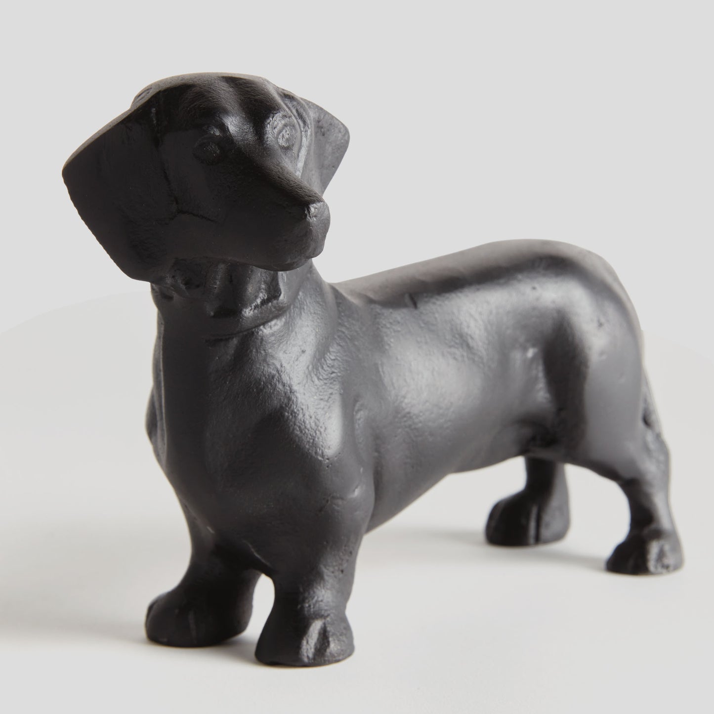 Black aluminum dachshund sculpture - stylish home accent (Image1).