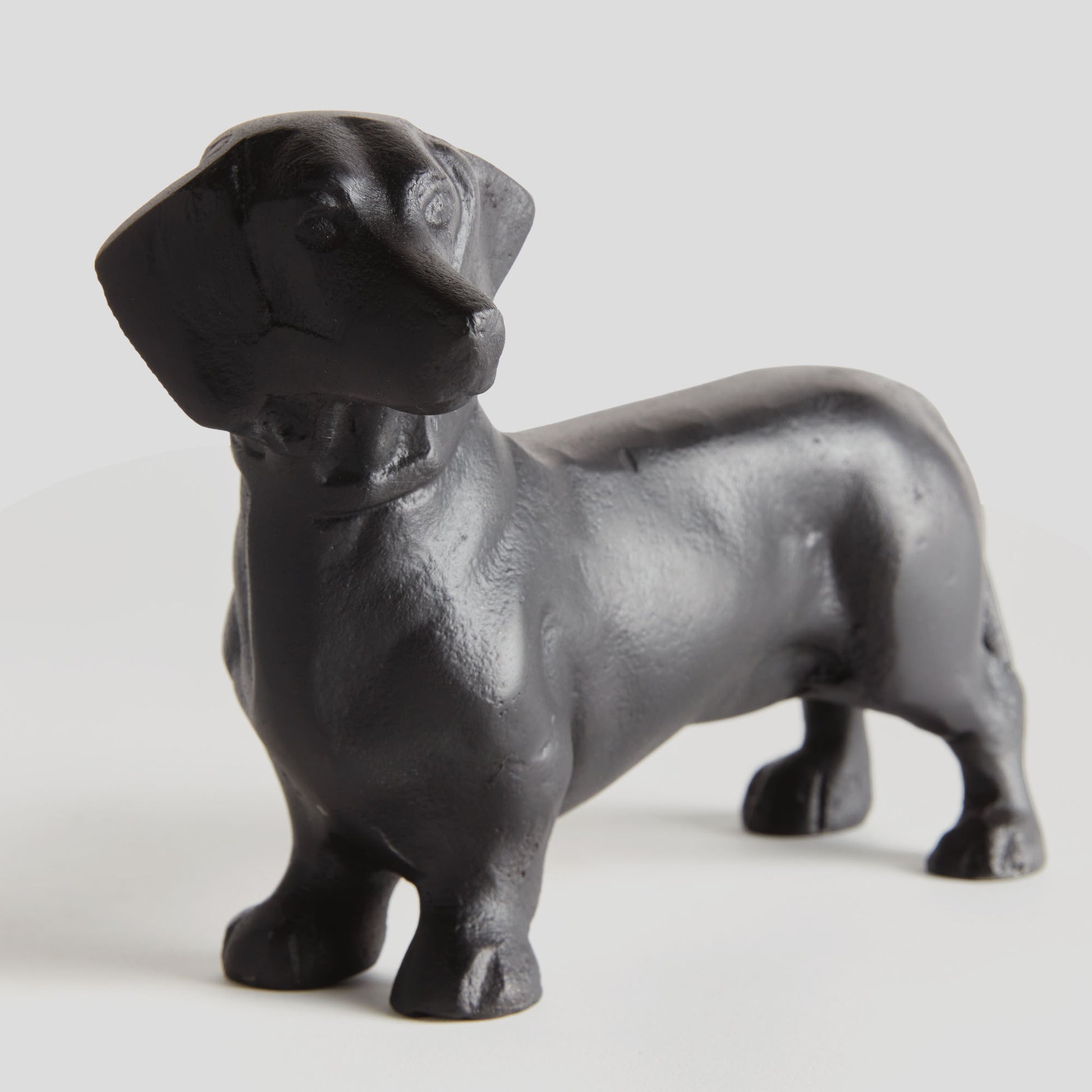 Black aluminum dachshund sculpture - stylish home accent (Image1).