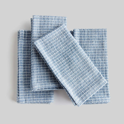 Blue windowpane square cotton dinner napkins set of 4 with gray background.