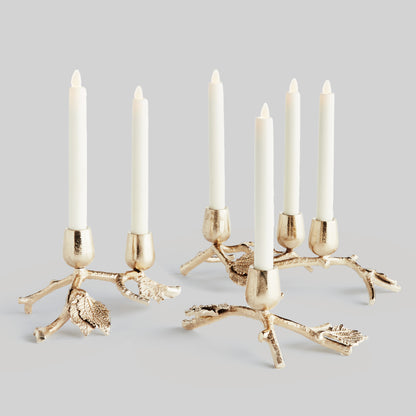 Branch and leaf taper candleholders, set of 3, with gray background.