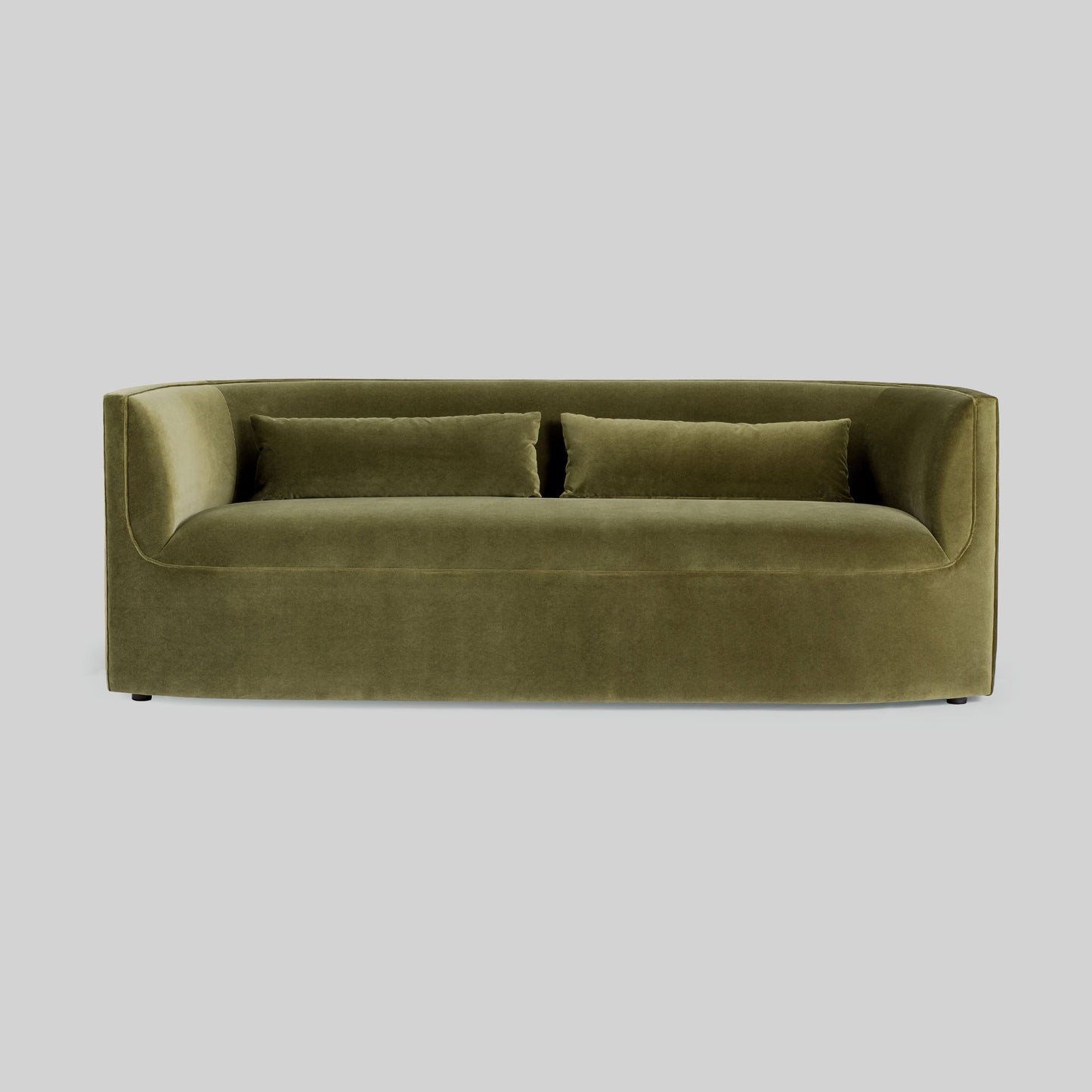 Green fabric sofa on a light gray background.