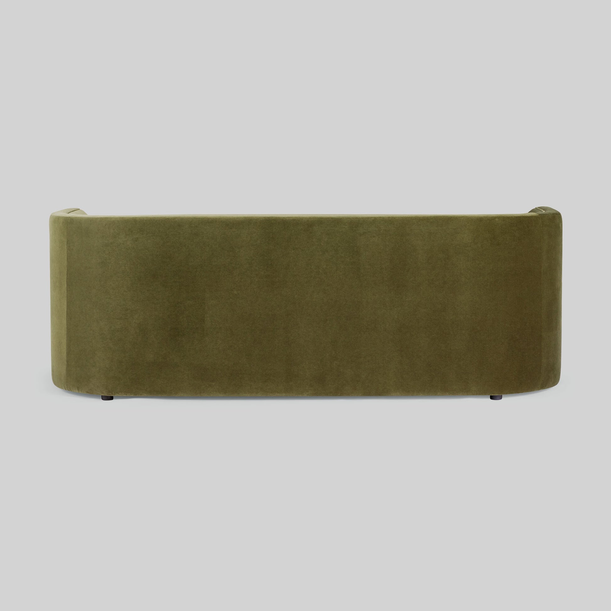 Green fabric sofa on a light gray background.