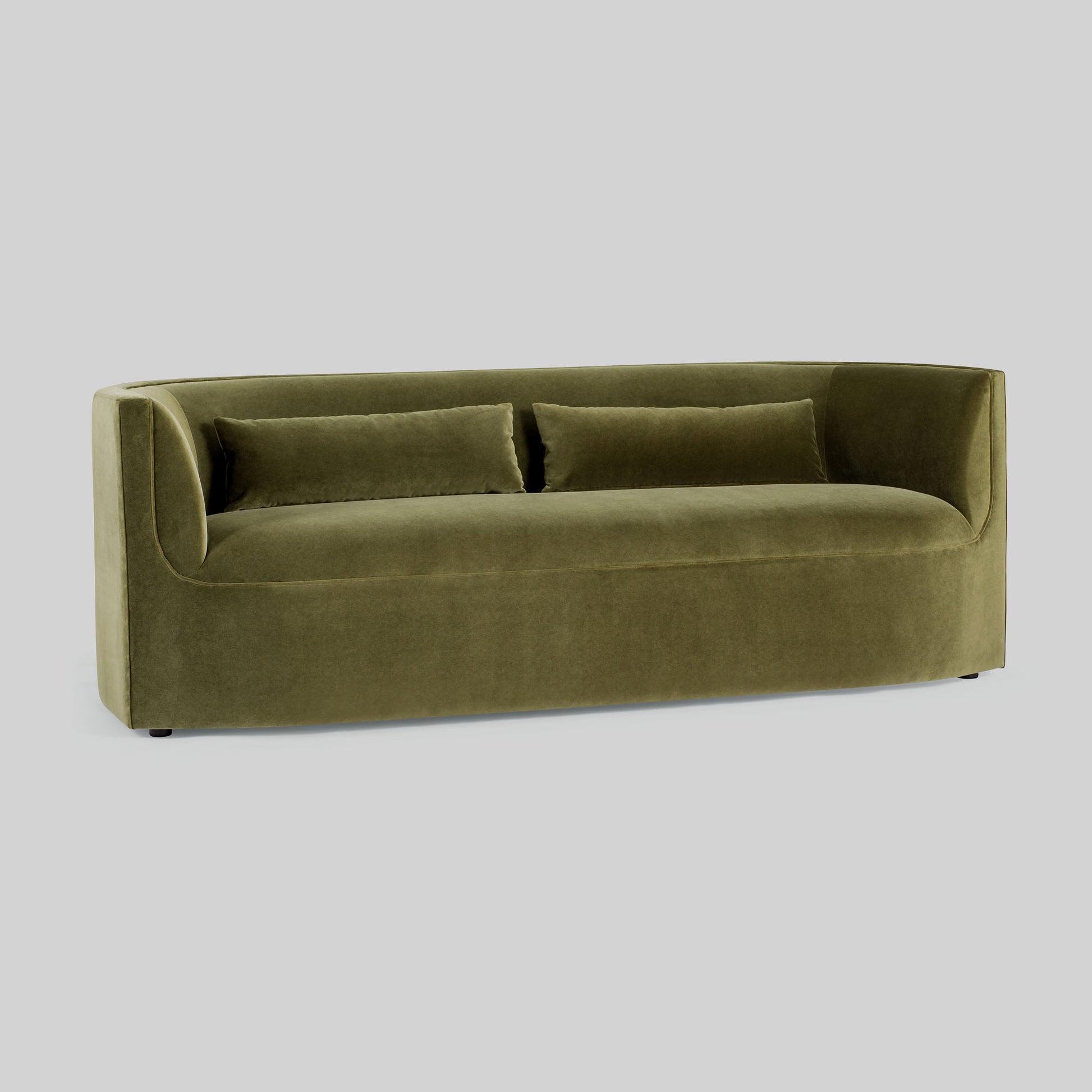 Green fabric sofa on a light gray background.