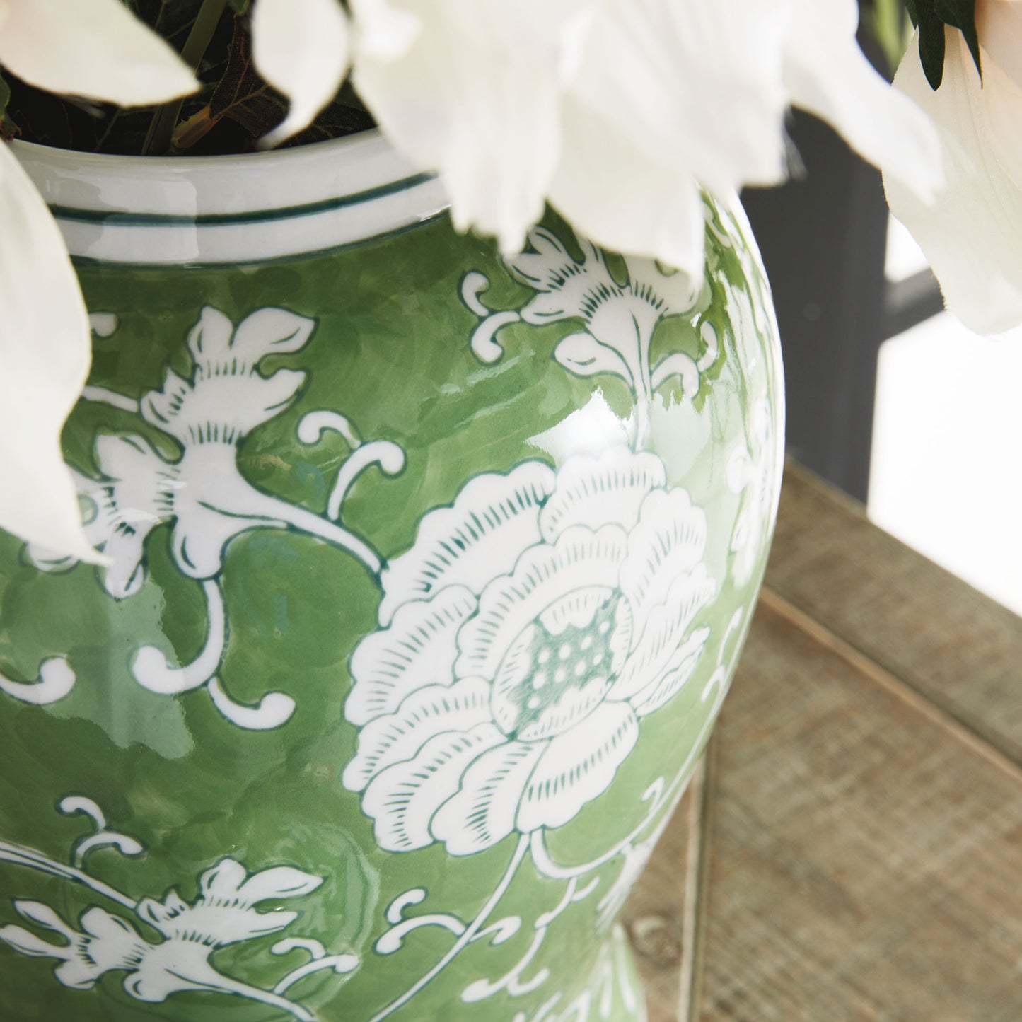 Chinoiserie green and white medium porcelain ginger jar, closeup view of jar design.