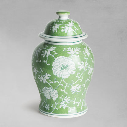 Chinoiserie green and white medium porcelain ginger jar with gray background.