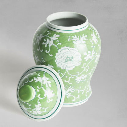 Chinoiserie green and white medium porcelain ginger jar, removed lid, with gray background.