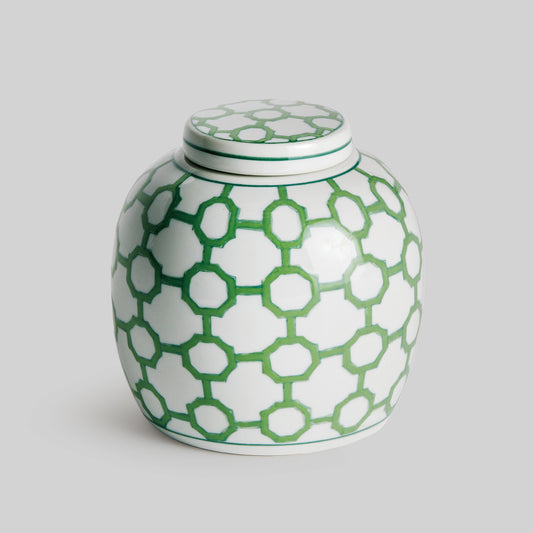 Chinoiserie green and white porcelain decorative jar with gray background.