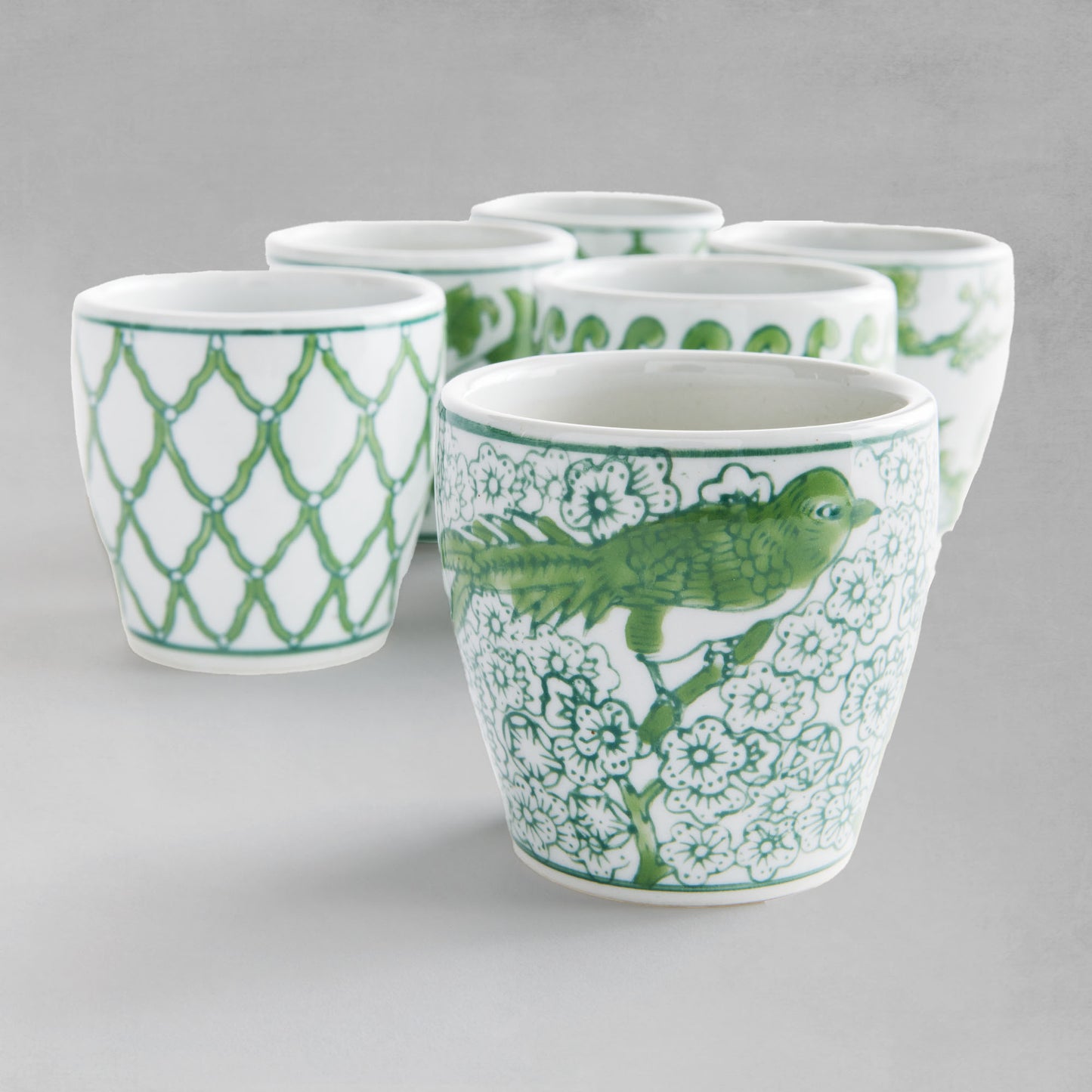 Set of 6 chinoiserie green and white porcelain flower pots, closeup view.