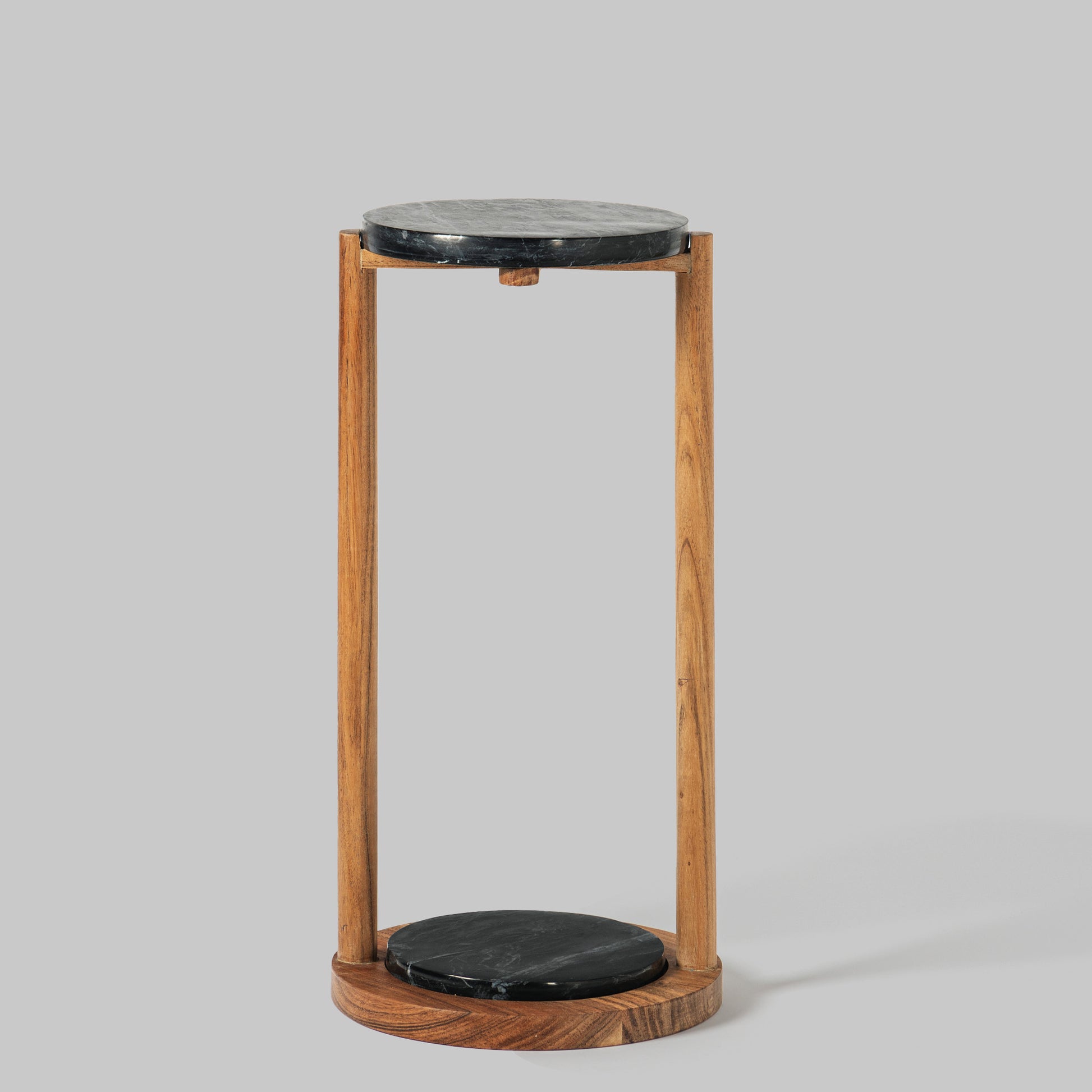 Contemporary acacia wood and black marble accent table.