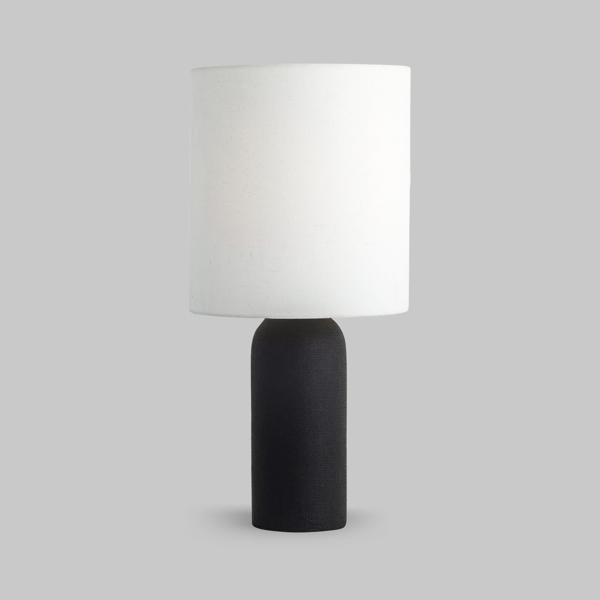 Contemporary black textured table lamp.