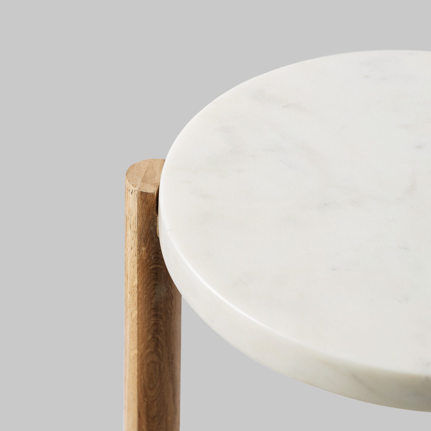 Contemporary oak wood and white marble accent table, top view.