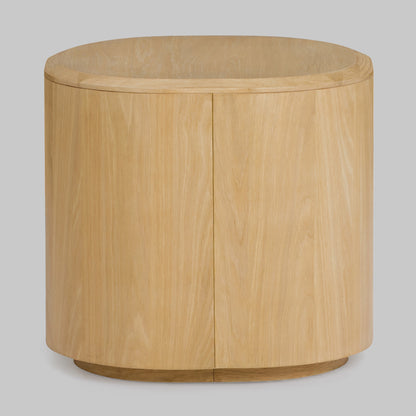 Contemporary round oak side table, natural finish, back view.