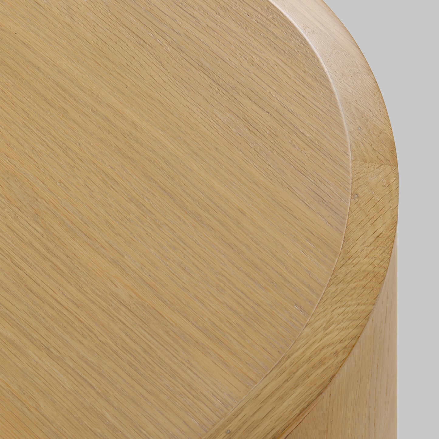 Contemporary round oak side table, natural finish, top view.