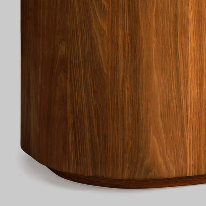 Contemporary round oak side table, walnut finish, closeup view.