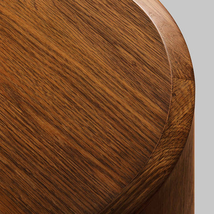 Contemporary round oak side table, walnut finish, top view.