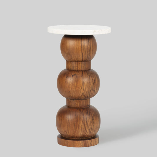 Wooden side table with a white marble top on a gray background.