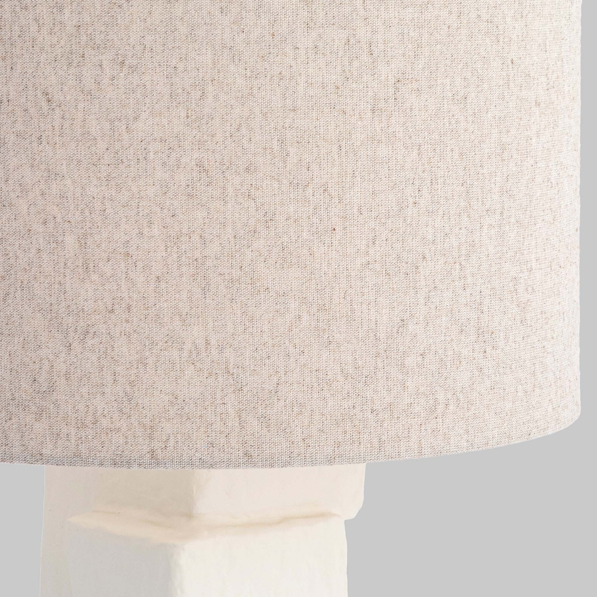 Contemporary white plaster table lamp, closeup view of lampshade.