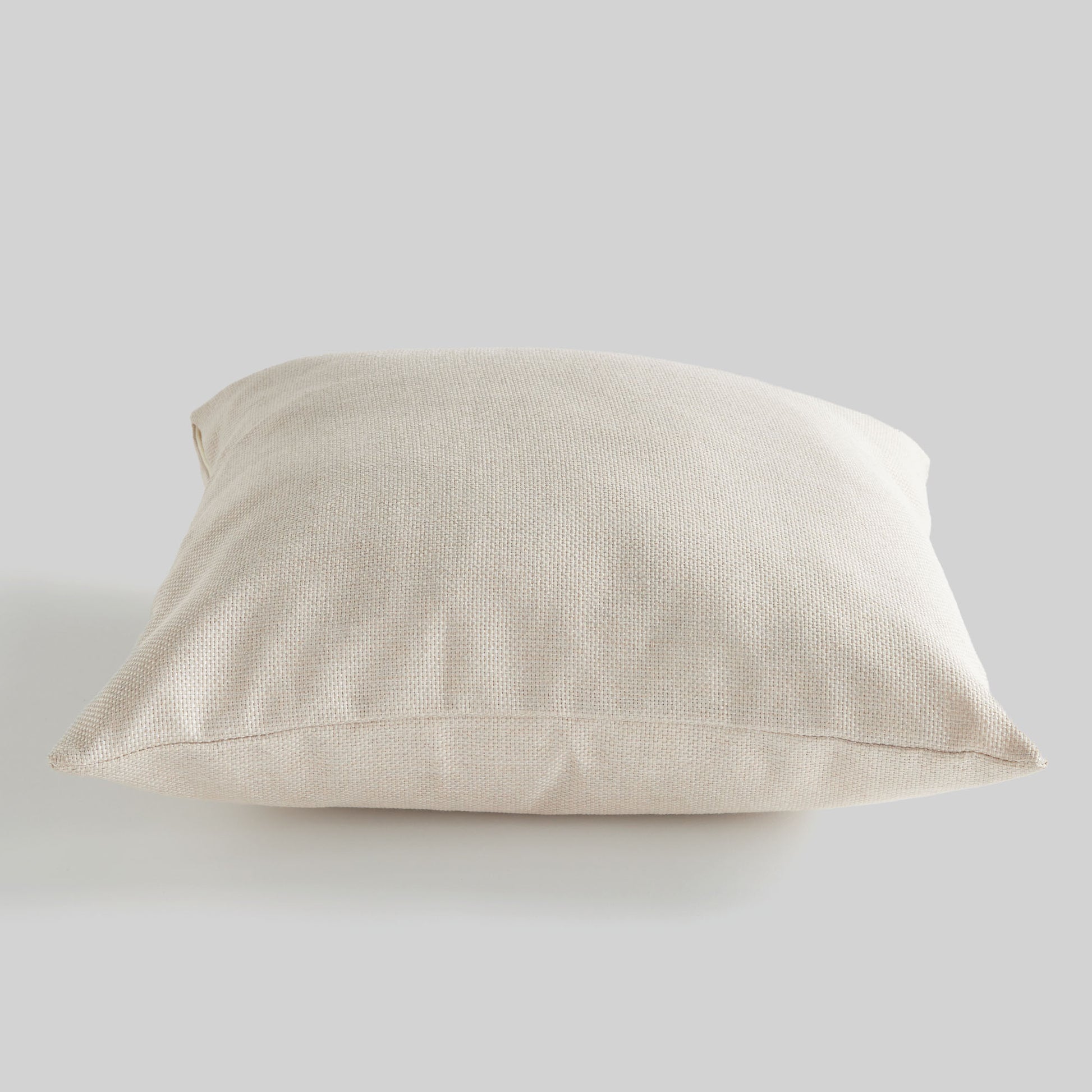 Cream jacquard woven pillow for home decor and accessories.