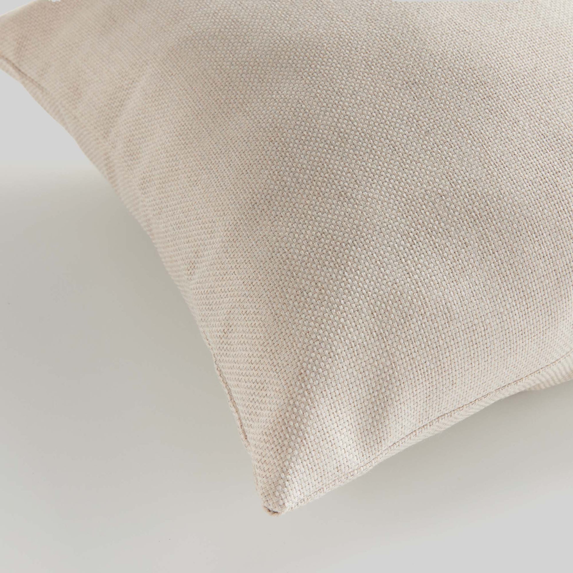 Cream jacquard woven pillow for home decor and accessories.