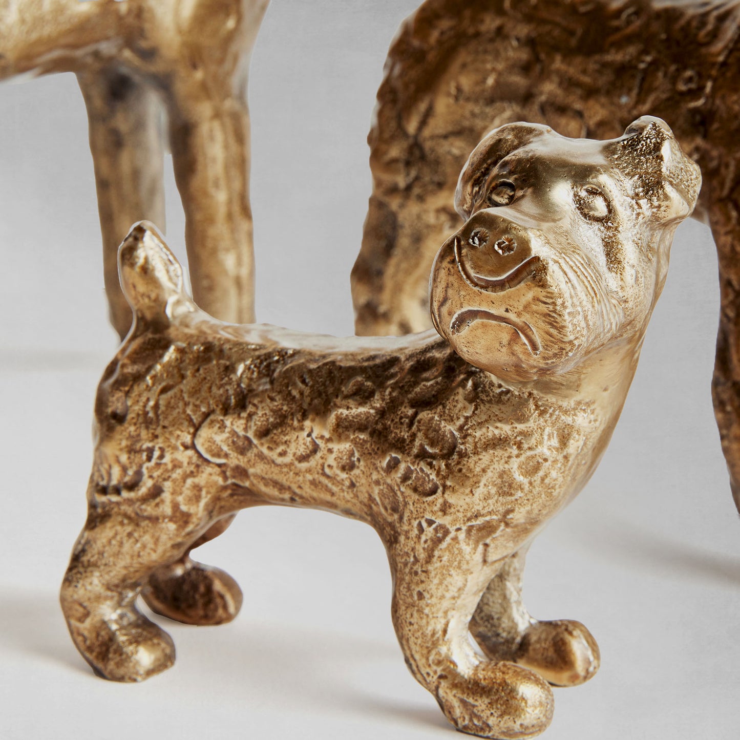 Decorative dog objects, set of 3, closeup view.