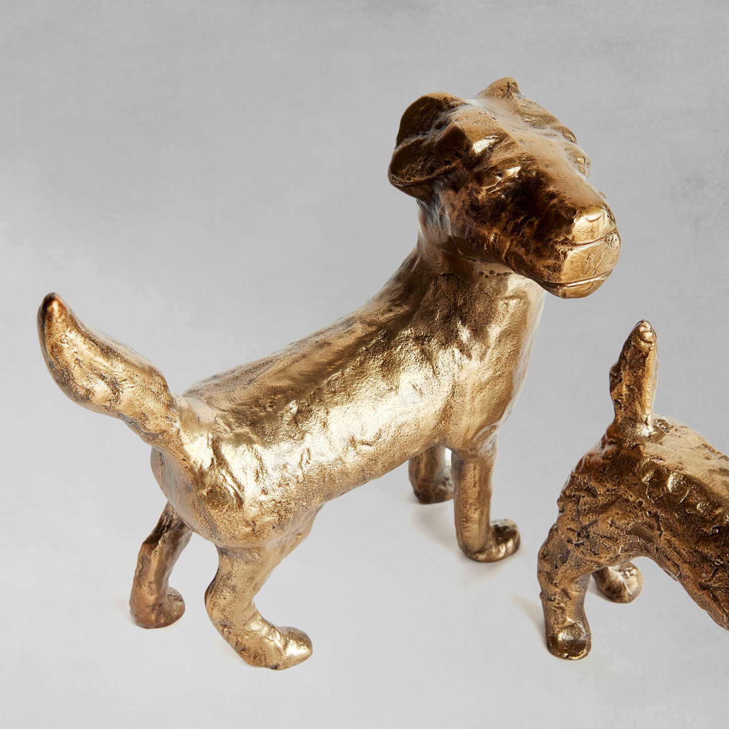 Decorative dog objects, set of 3, closeup view.