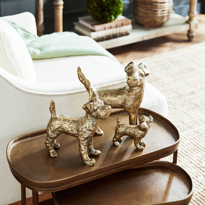 Decorative dog objects, set of 3, stylized in living room.