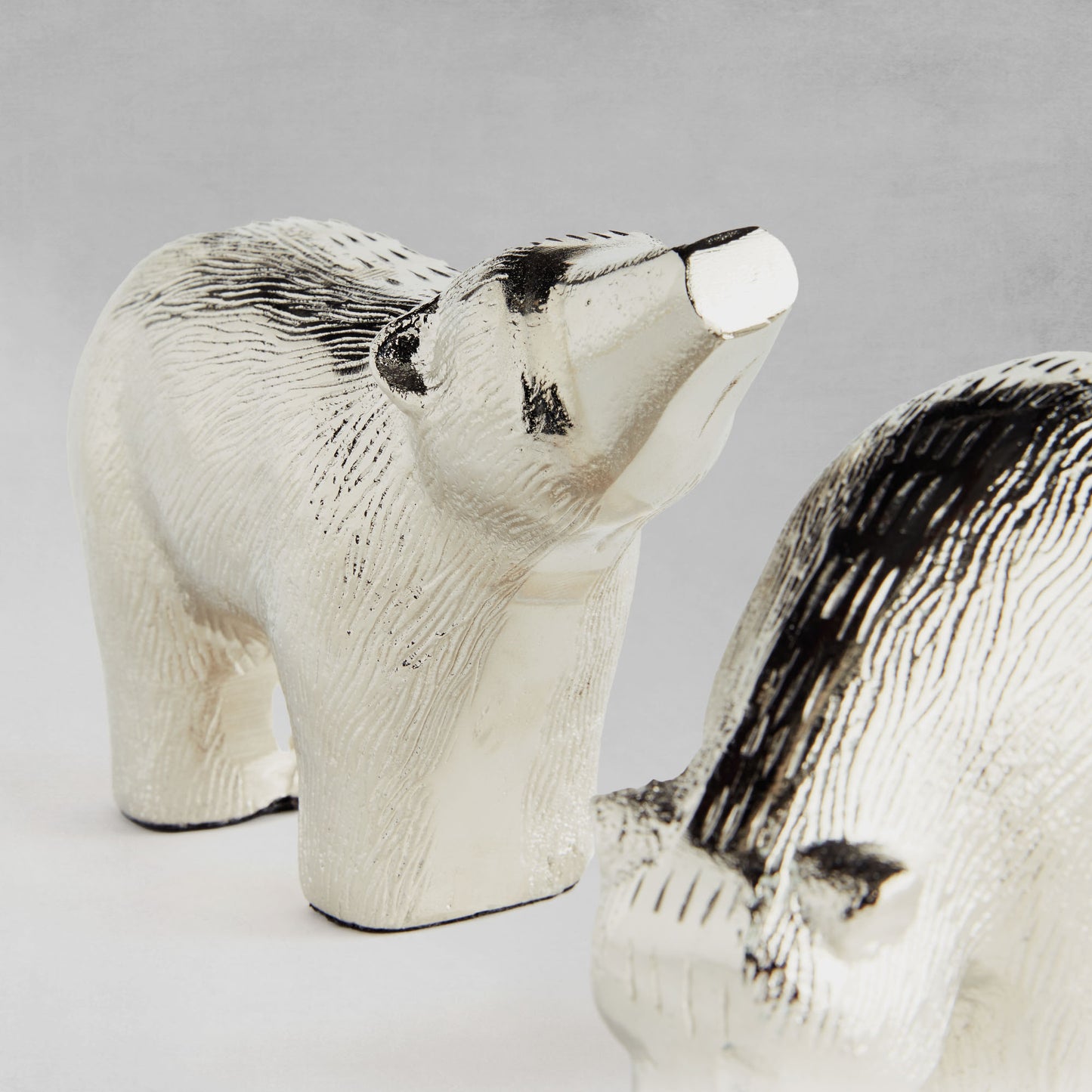 Decorative silver bears, set of two, closeup view.