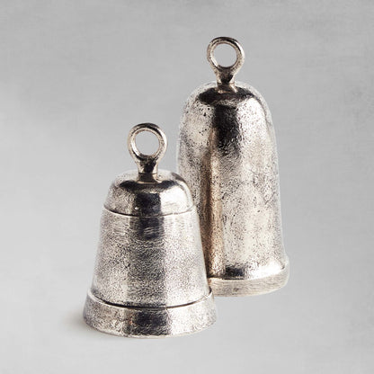 Decorative silver bells, set of 2, with gray background.