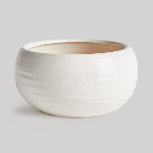 Decorative white stoneware bowl - stylish home accent (Image1).