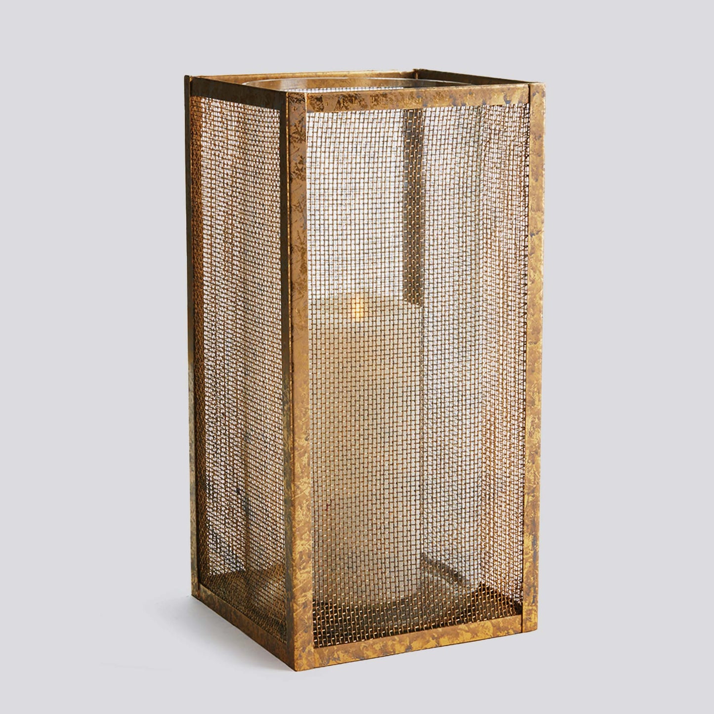 Gold mesh large hurricane candleholder with light gray background.