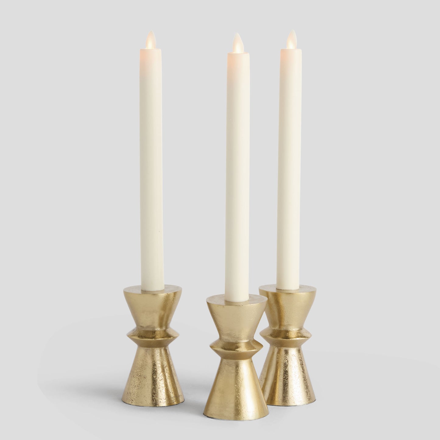 Gold taper candle holders (set of 3) - stylish home accent (Image1).