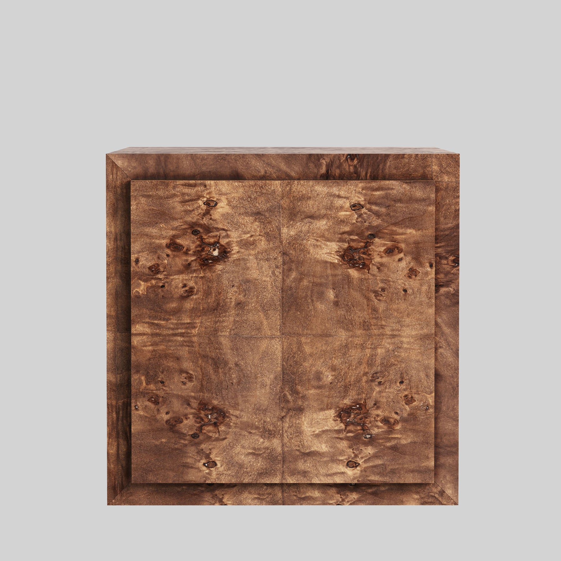 Dark burl wood plinth side table on gray background.