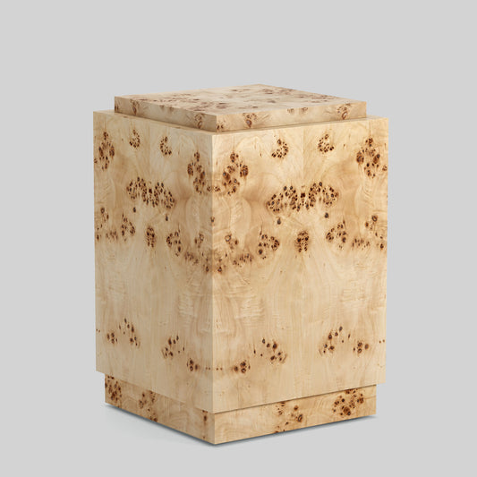 Light burl wood plinth side table on gray background.