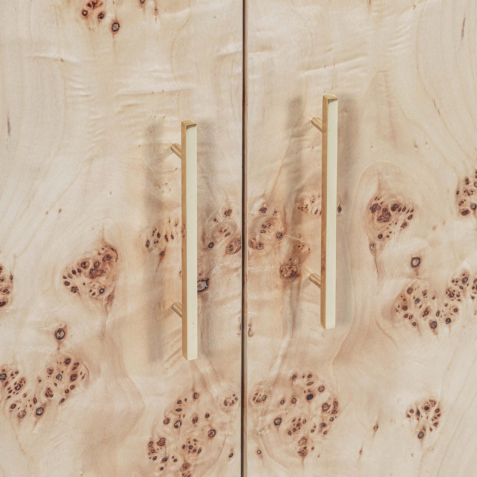 Light burl wood sideboard table on gray background.