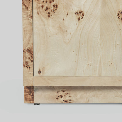 Light burl wood sideboard table on gray background.
