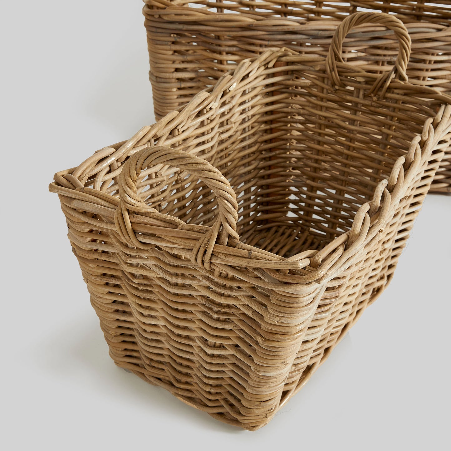 Gray rattan laundry baskets (set of 2) - stylish home accent (Image1).