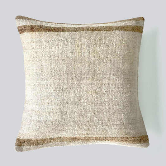 Handwoven Turkish kilim hemp pillow cover in sand with light caramel stripes.