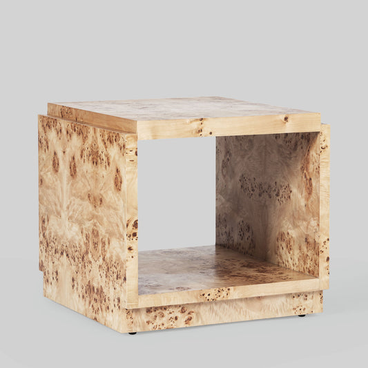 Light burl wood side table on gray background.