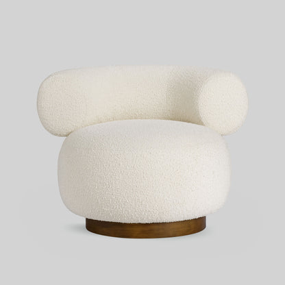 Light colored boucle fabric swivel chair on gray background.