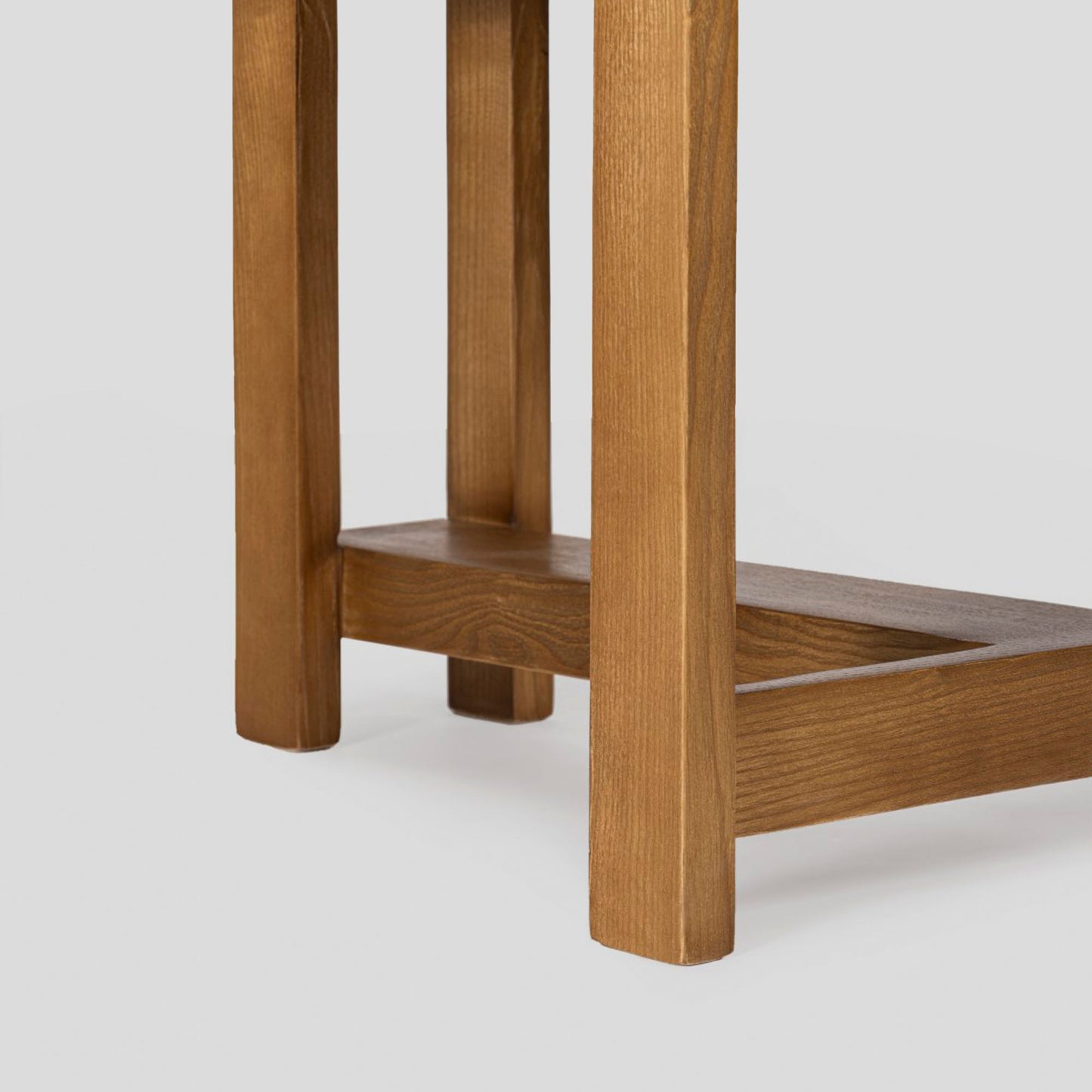 Wooden stool with a simple design on a white background