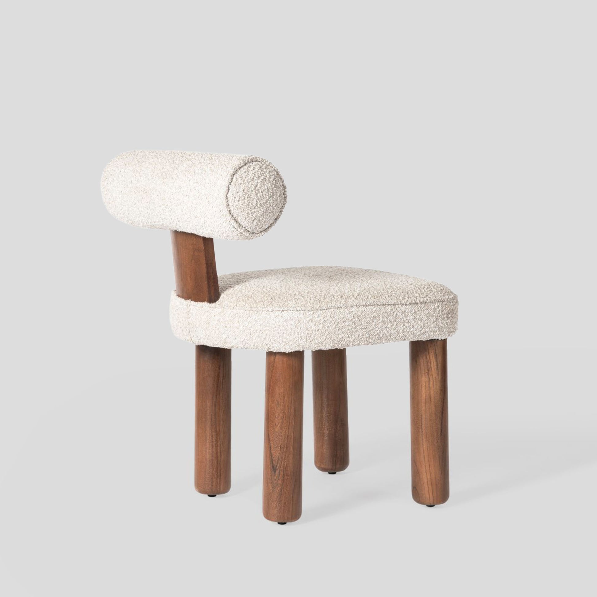 Chair with wooden legs and textured fabric seat on a light gray background