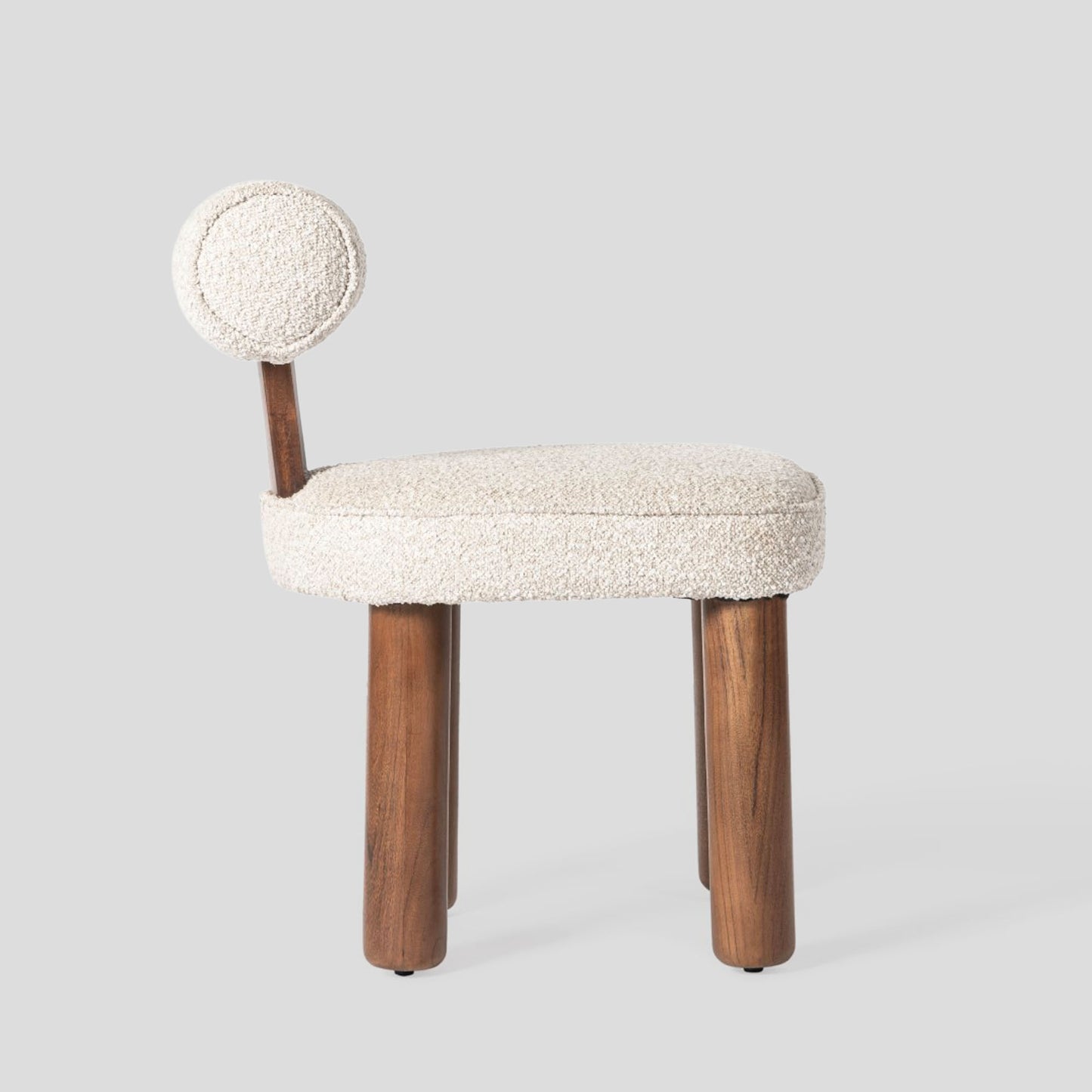 Small chair with a textured white seat and backrest on a light gray background