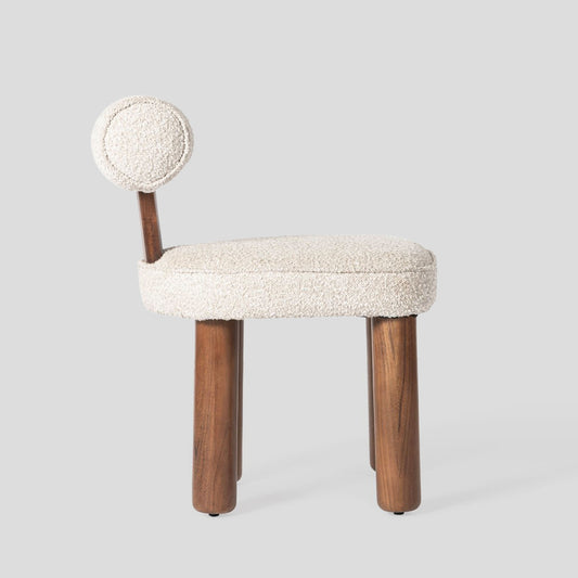 Small chair with a textured white seat and backrest on a light gray background